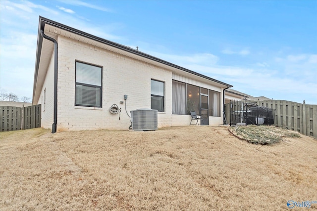 rear view of property featuring cooling unit