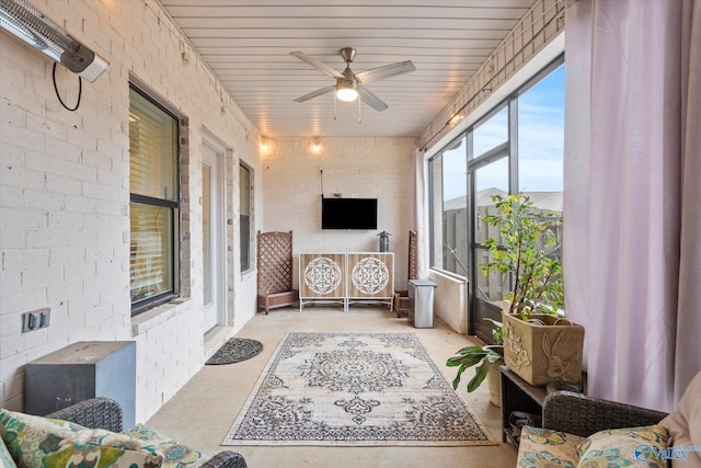 sunroom / solarium with ceiling fan