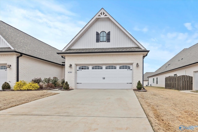 view of front of home with a garage and a front lawn