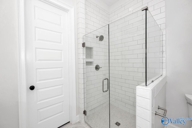 bathroom with an enclosed shower