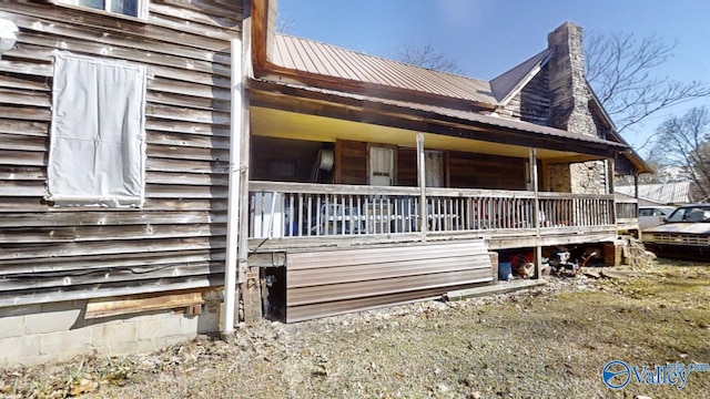 view of property exterior featuring a porch