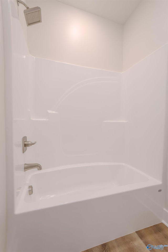 bathroom featuring shower / bathtub combination and wood-type flooring