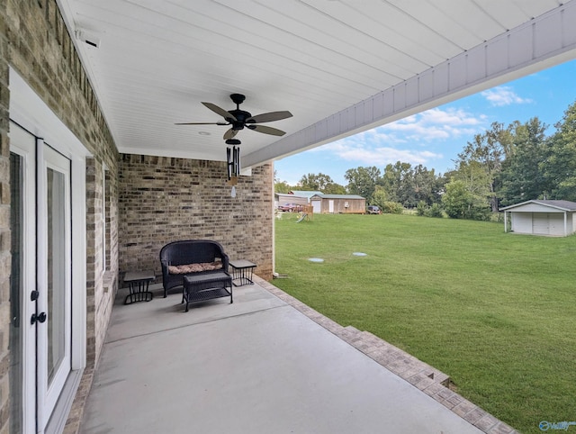 view of patio / terrace with an outdoor living space and ceiling fan