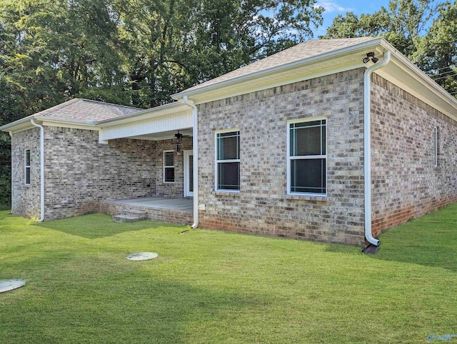 view of front of house with a patio area, a front lawn, and ceiling fan