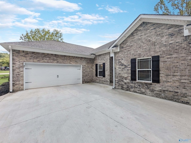 view of property exterior with a garage