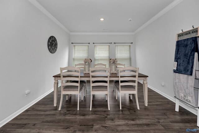 dining area featuring ornamental molding and dark hardwood / wood-style floors