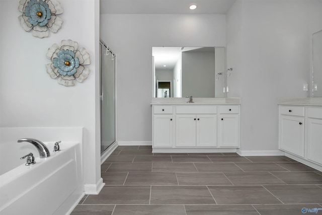 bathroom with vanity and plus walk in shower