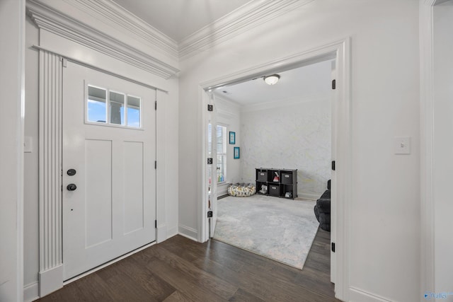 foyer entrance featuring ornamental molding and dark hardwood / wood-style flooring