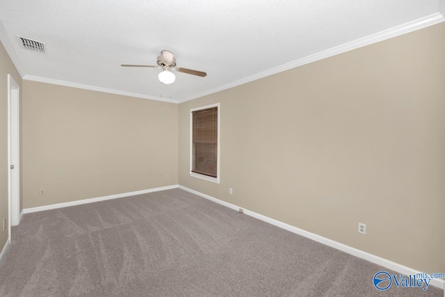 carpeted empty room featuring crown molding and ceiling fan