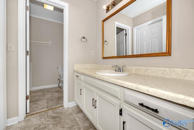 bathroom featuring vanity and toilet