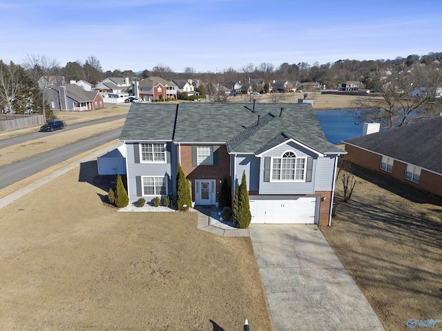 view of front of property with a garage and a front lawn