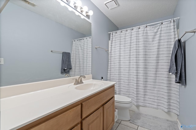 full bathroom with shower / tub combo with curtain, toilet, a textured ceiling, vanity, and tile patterned flooring