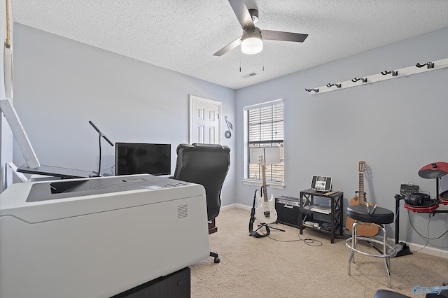 office featuring ceiling fan and a textured ceiling