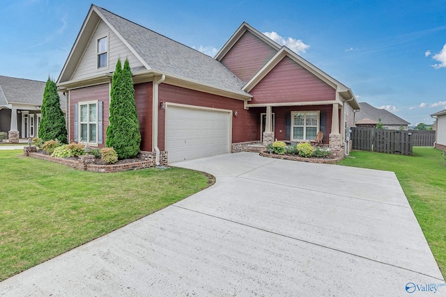 view of front facade with a garage and a front yard