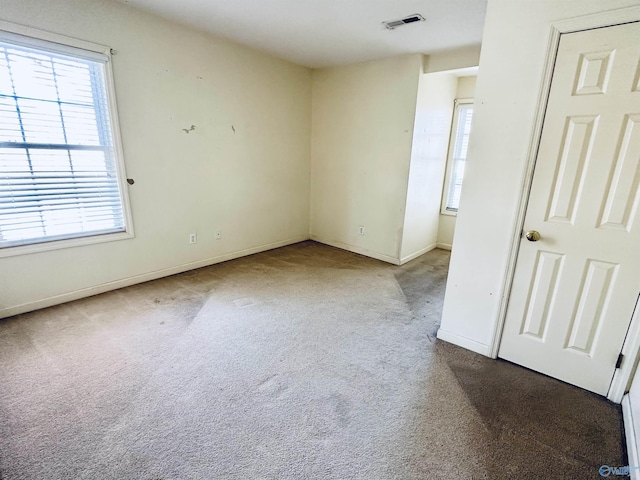 spare room featuring carpet flooring