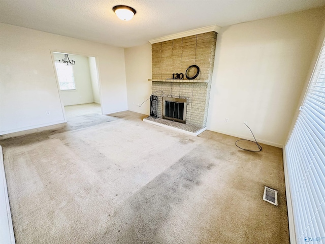 unfurnished living room featuring carpet flooring and a fireplace