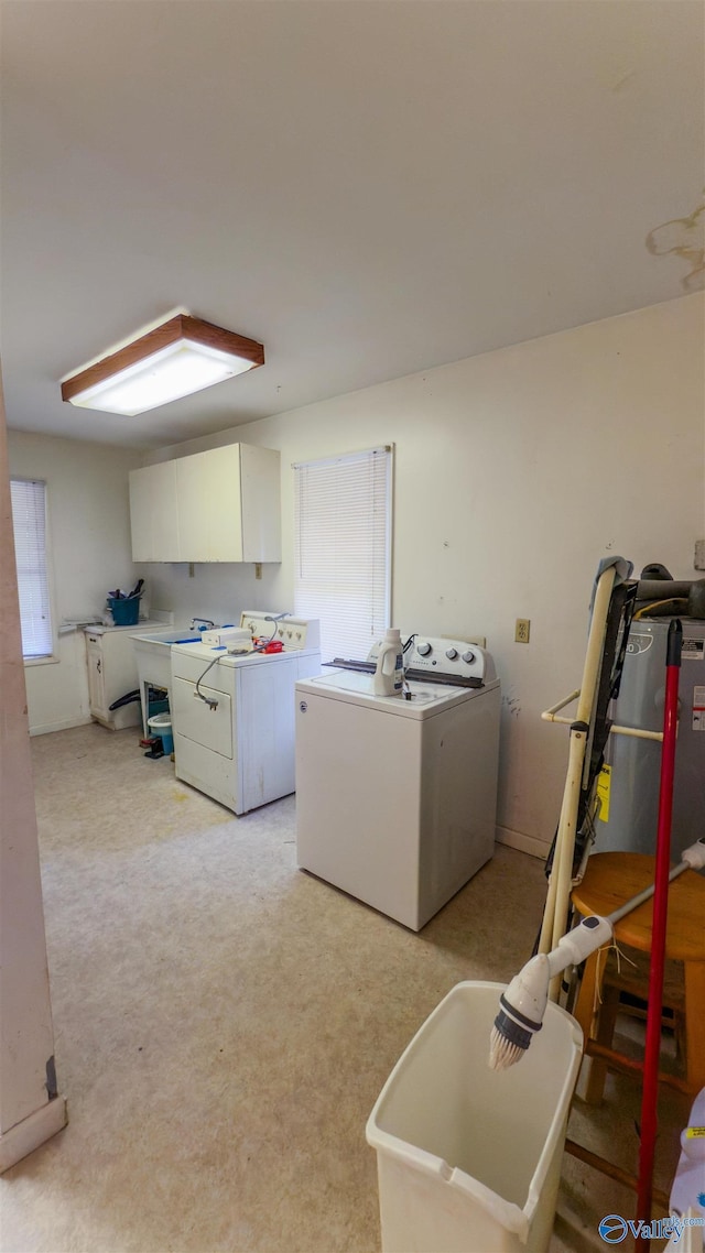 2808 Elmore Rd, Huntsville, AL 35805 - laundry room featuring washing machine and dryer, cabinet space, and light colored carpet