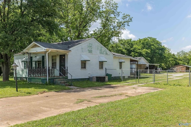 2808 Elmore Rd, Huntsville, AL 35805 - view of front of property featuring covered porch, a gate, central AC, and concrete driveway