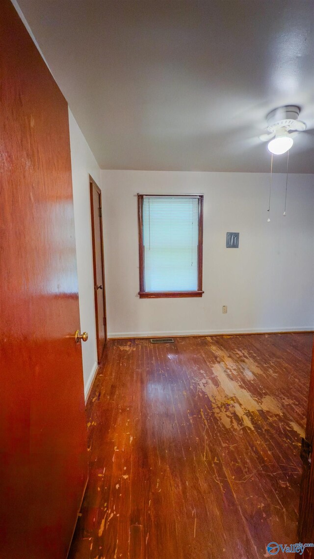 2808 Elmore Rd, Huntsville, AL 35805 - empty room with wood finished floors, baseboards, and ceiling fan