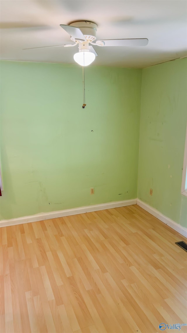 2808 Elmore Rd, Huntsville, AL 35805 - spare room with light wood-style flooring, ceiling fan, and baseboards