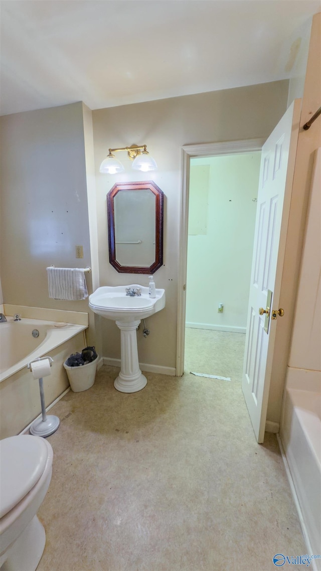 2808 Elmore Rd, Huntsville, AL 35805 - full bath with a bath, toilet, and baseboards
