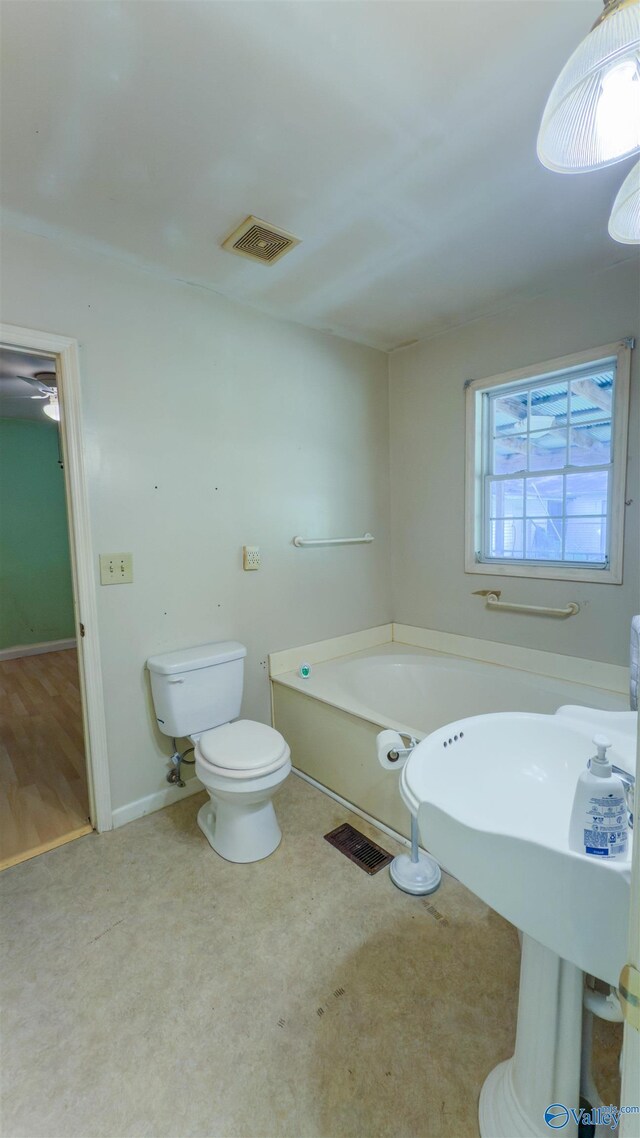 2808 Elmore Rd, Huntsville, AL 35805 - bathroom featuring a bath and toilet