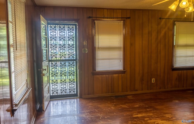 2808 Elmore Rd, Huntsville, AL 35805 - entrance foyer featuring ceiling fan, wooden walls, hardwood / wood-style floors, and baseboards