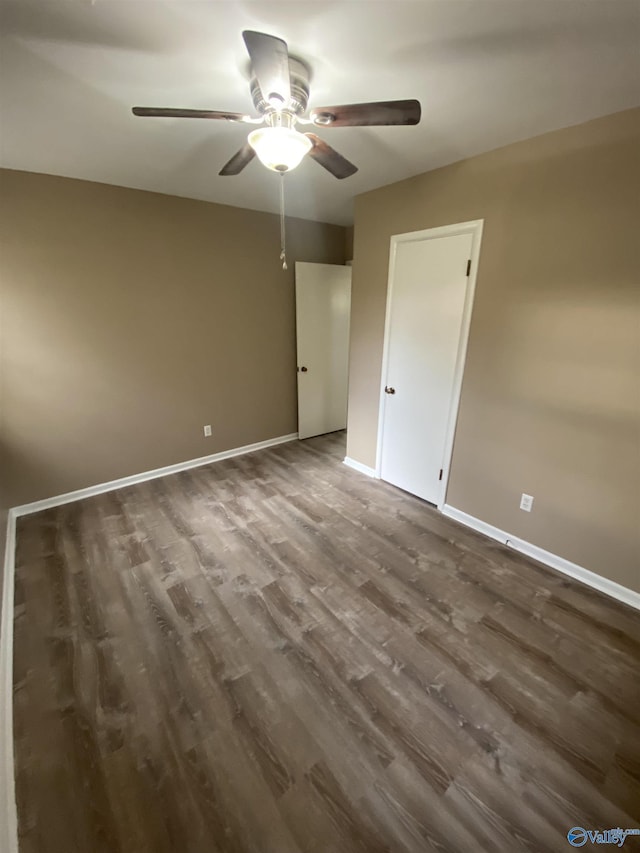 interior space featuring ceiling fan and dark hardwood / wood-style flooring