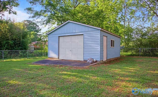 garage with a lawn