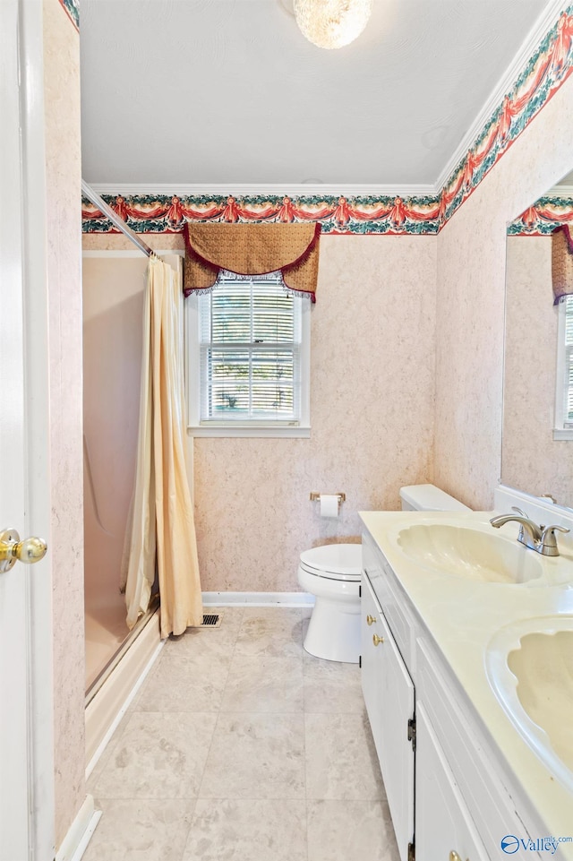 bathroom with walk in shower, vanity, and toilet