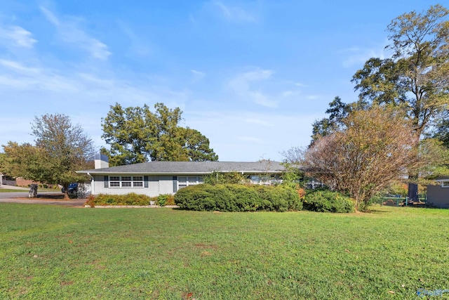 ranch-style house with a front yard