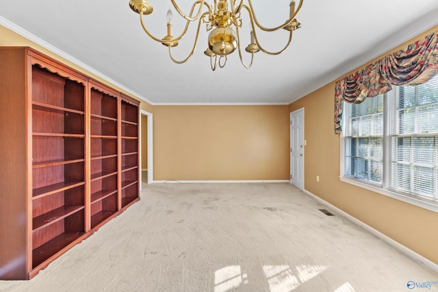 carpeted empty room with a chandelier and ornamental molding