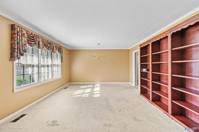 carpeted empty room with crown molding and a notable chandelier