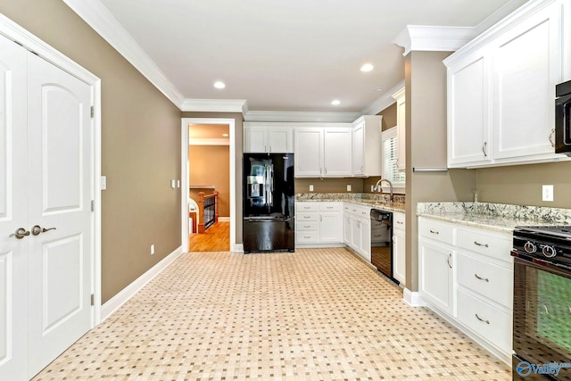 kitchen with light stone countertops, black appliances, sink, white cabinetry, and ornamental molding