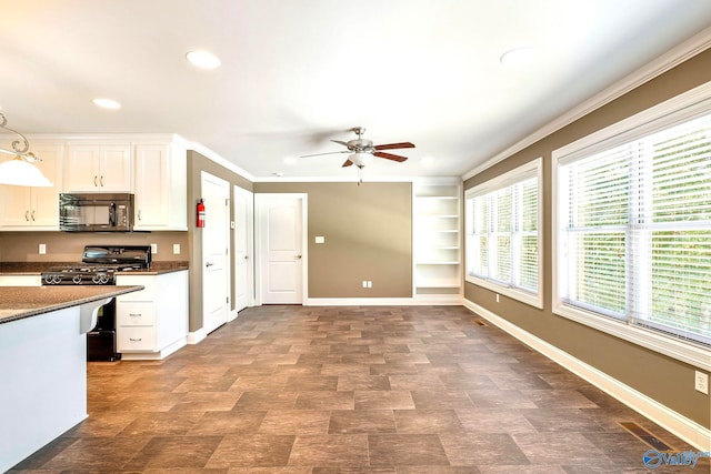 kitchen with white cabinets, hanging light fixtures, ceiling fan, black appliances, and crown molding