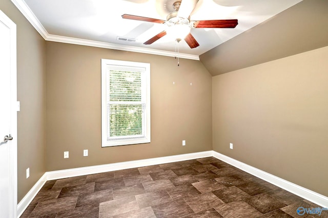 spare room featuring lofted ceiling, ornamental molding, and ceiling fan