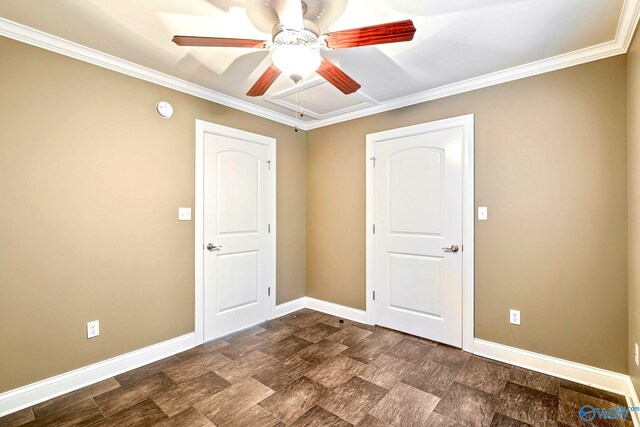 empty room featuring crown molding and ceiling fan