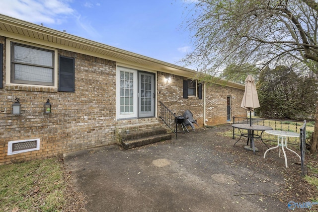 back of house with a patio