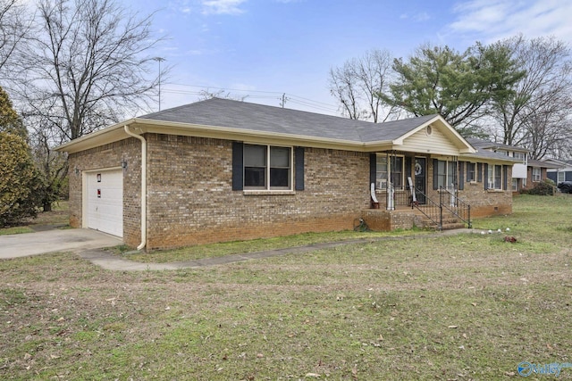 ranch-style house featuring a garage, a front yard, and covered porch