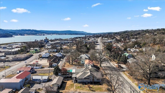 birds eye view of property featuring a water and mountain view