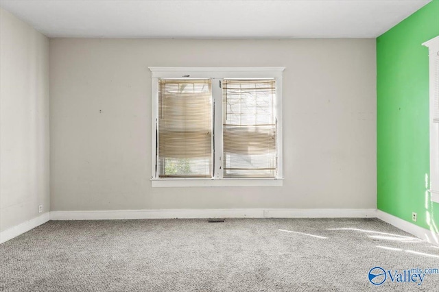 empty room with carpet flooring