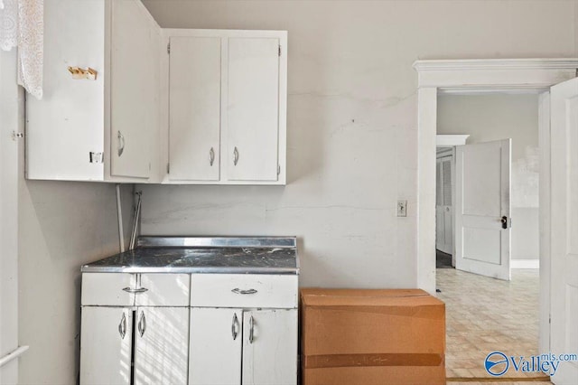 kitchen featuring white cabinets