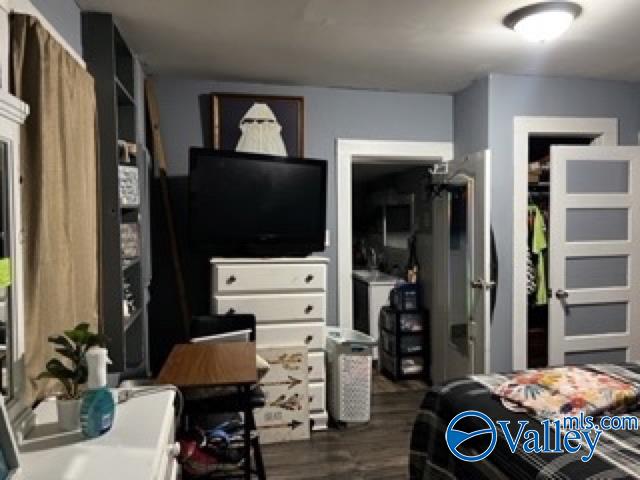 bedroom featuring dark hardwood / wood-style flooring