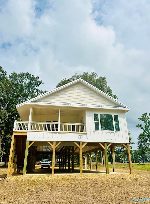 coastal inspired home featuring a carport