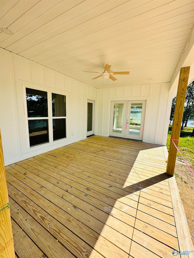 wooden terrace featuring ceiling fan