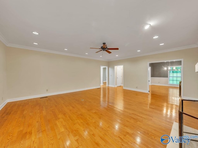unfurnished room featuring recessed lighting, baseboards, light wood-type flooring, a ceiling fan, and crown molding