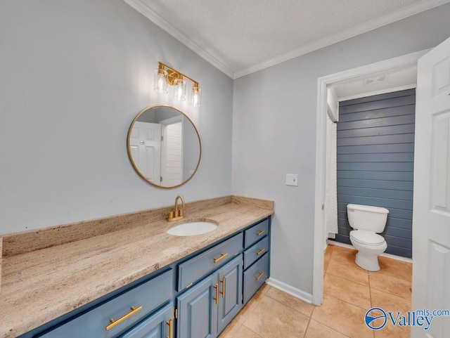 full bath with crown molding, baseboards, toilet, vanity, and tile patterned flooring