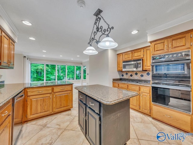 kitchen with appliances with stainless steel finishes, tasteful backsplash, ornamental molding, and hanging light fixtures