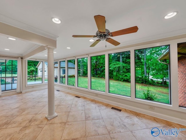 unfurnished sunroom featuring visible vents