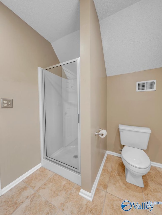 full bathroom with tile patterned floors, visible vents, a shower stall, and lofted ceiling